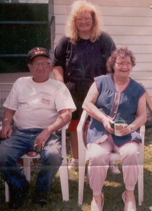 Dad , Mom , and Me in the backyard at the house